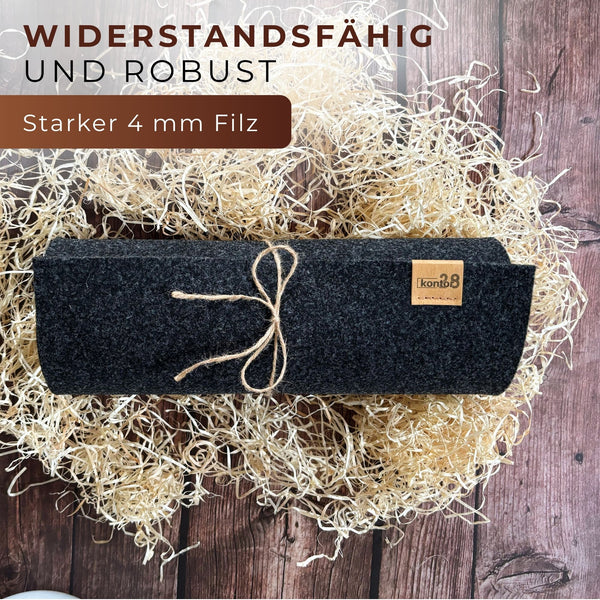 Tischläufer aus Filz anthrazit biskop nachhaltig Made in Germany rechteckig eingerollt auf einem Tisch widerstandsfähig und robust