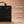 Infografik zur Kaminholztasche aus schwarzem Filz mit Produktvorteilen und Ledergriff im Detail